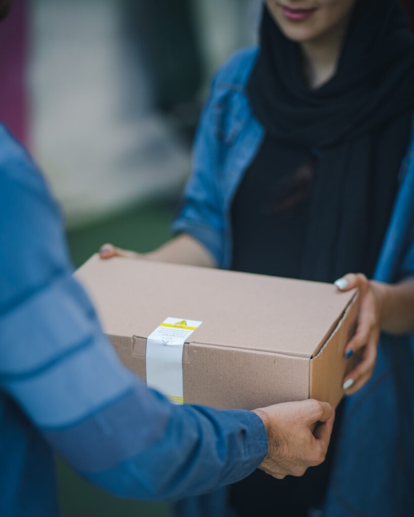 Delivery box being handed over