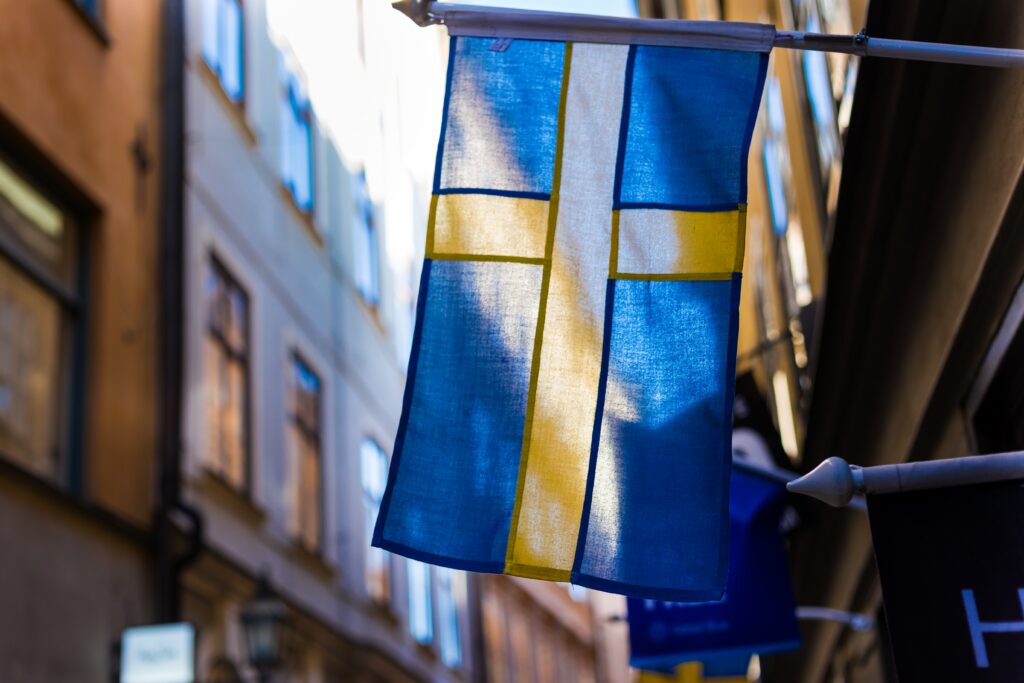Swedish flag hanging outside a building