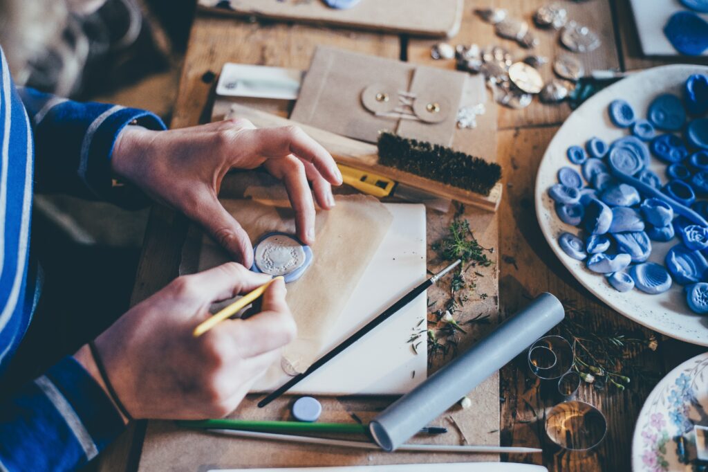 Hands making jewellery