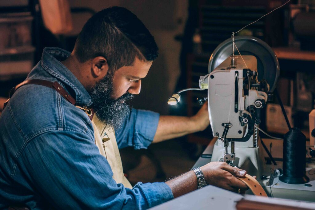 Man using sewing machine