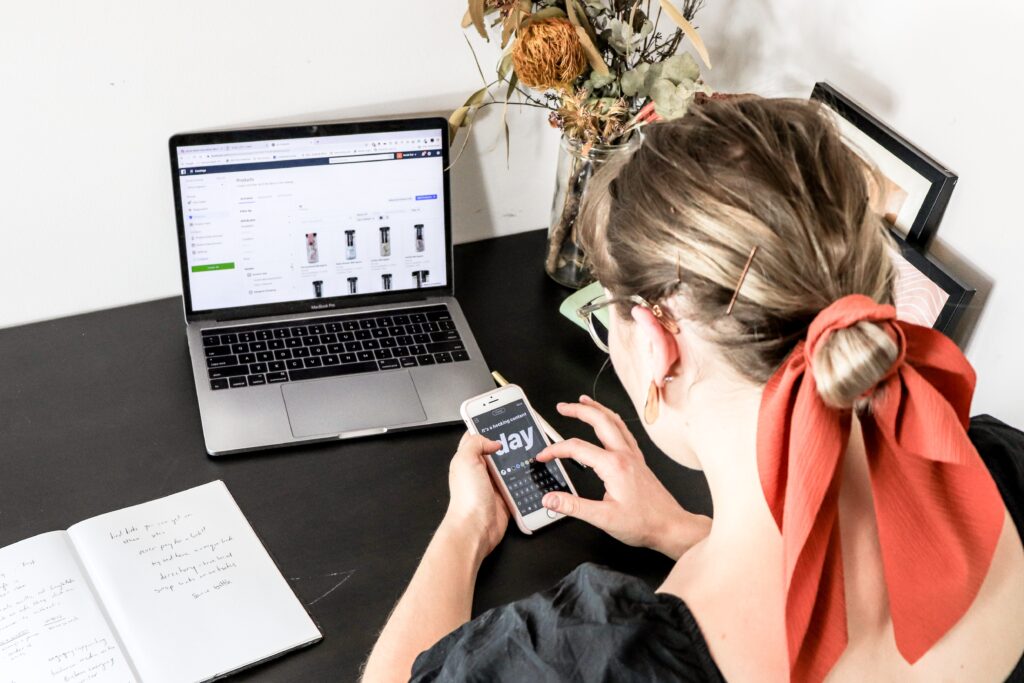 Woman using phone and shopping online